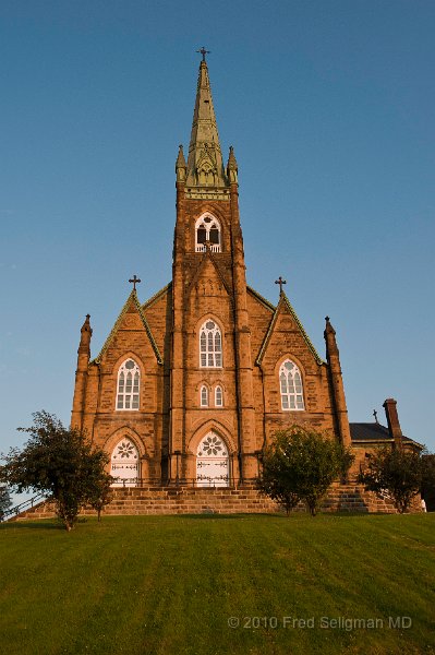 20100721_181949 Nikon D3.jpg - Basilica of St Michaels is one of the largest churches in Canada east of Quebec (completed`1921)  It overlooks the Miramichi River at Chatham, NB (now Miramichi, NB).  The neo-Gothic structure was designed by Irish architect Patrick Keely who also designed Holy Name Cathedral in Chicago (State St), the home of the Archbishop of Chicago.  He also designed churches in Providence, RI and Montreal.  Because the church is situated on a hill it is seen for miles, especially when approaching from the north.  The parish was built in the 1800s by the Irish escaping the famines of Ireland.  A little known fact is that when the Irish Catholics came to Canada, unlike their counterparts in the United States, they were barred from public office and the professions!!!